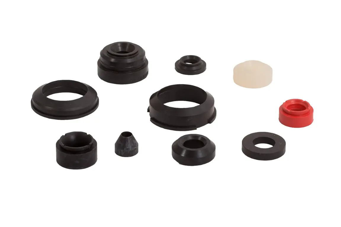 Bottle seals and spreaders for filling and processing equipment