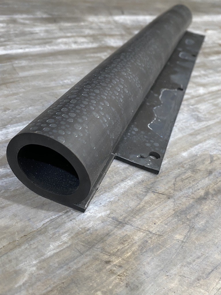 Offset tadpole rubber extrusion