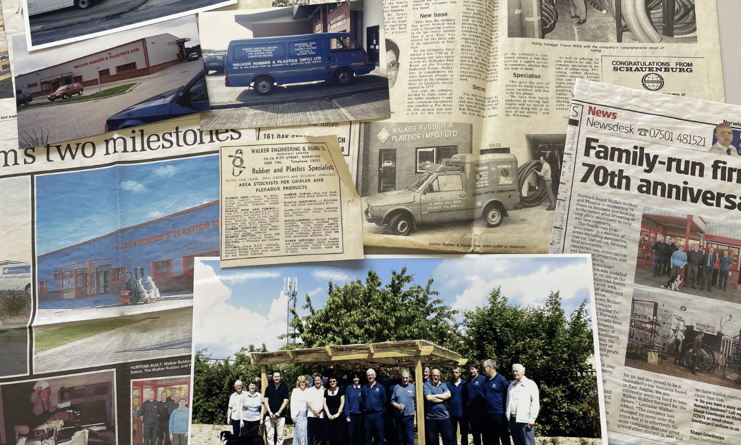 Walker Rubber Collection of newspaper articles and photographs on a table from Walker Rubber's past.